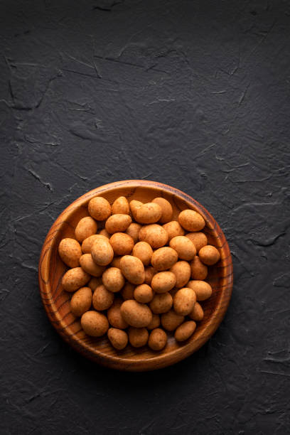 istock Organic mexican peanuts in the bowl - Arachis hypogaea 1449228394