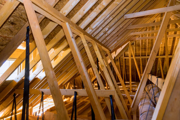 istock Ventilation pipes in the silver insulation material on the ceiling inside a newly built home under construction 1449230484