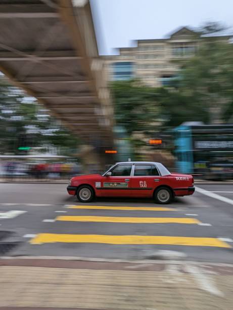istock Taxi speeding on road (long exposure) 1449235388