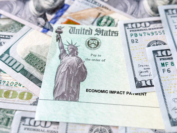 istock Stimulus check, 100 dollar bills and social Security Card 1449245474
