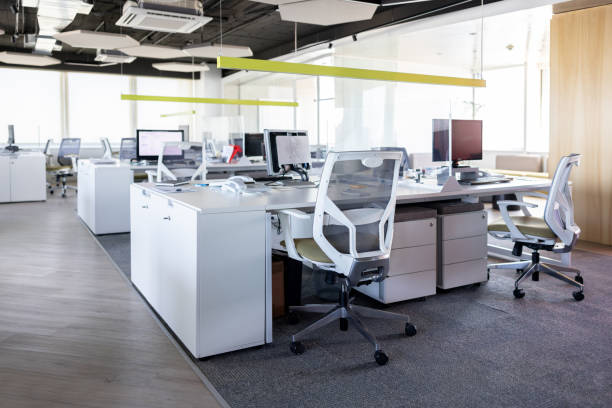 Modern office space with several cubicles Modern office space with several cubicles and no people - office cubicle no people stock pictures, royalty-free photos & images