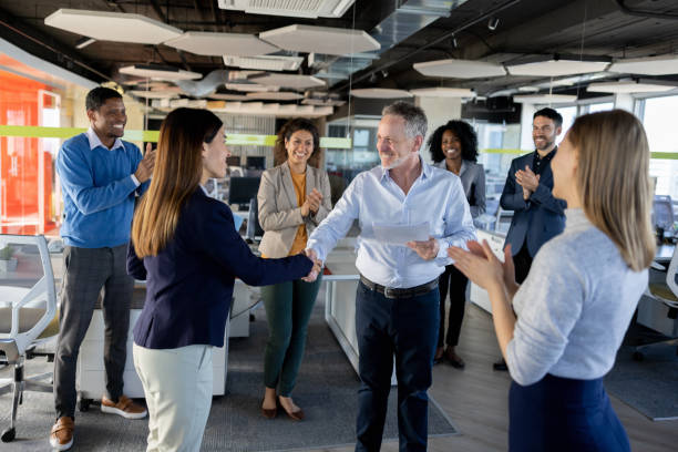 istock Business woman getting a promotion at work and handshaking her boss 1449248262