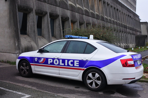 Paris - Nov 30 2022:National Police car parking outside police station building.The National Police is France main civil law enforcement agency, with primary jurisdiction in cities and large towns