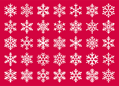 Set of vector snowflakes. White design elements on a red background.