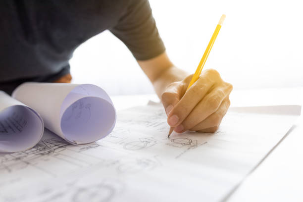 istock An engineer drawing a machine in his house 1449263037