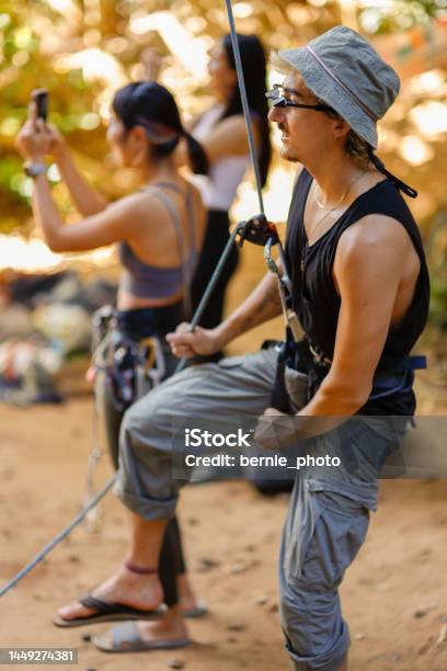 The Belayer Role In Rock Climbing Stock Photo - Download Image Now - Achievement, Active Lifestyle, Adults Only