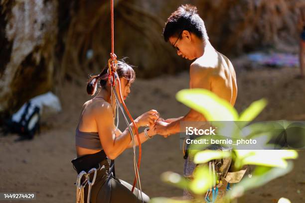 Team Members Getting Ready For Rock Climbing At Lime Climbing Site Stock Photo - Download Image Now