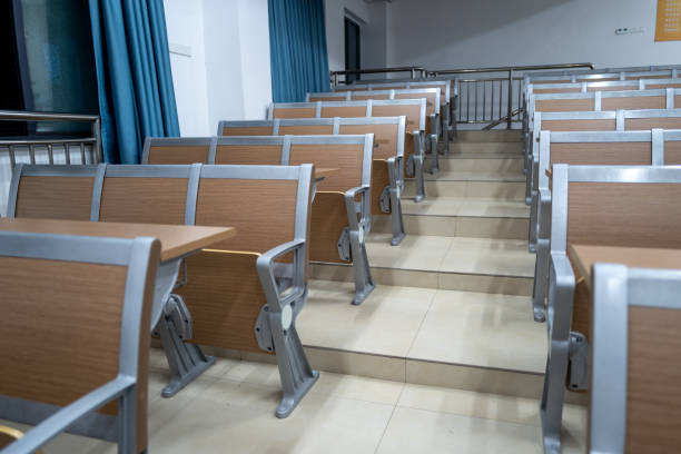 A classroom in a university. Rows of desks and chairs