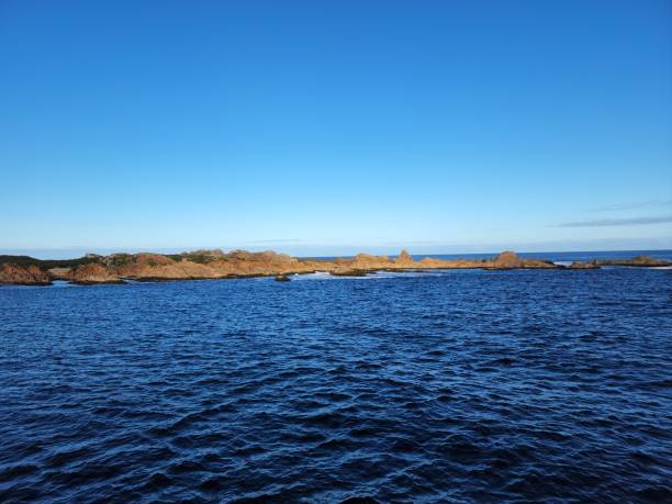 istock Ocean Bay with Rocky Outcrop 1449283927