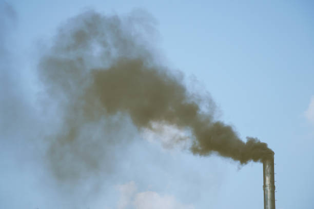 istock Black smoke pollution from industrial chimney. 1449285591