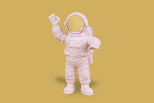 istock Astronaut making the ok sign on yellow background 1449288287