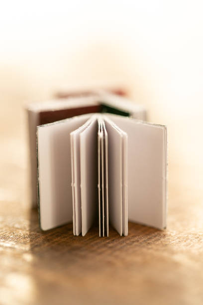istock stack of books on a wooden table on a light blurred background. soft focus.Learning and knowledge symbol.Reading and education.Literature and reading concept. 1449289414