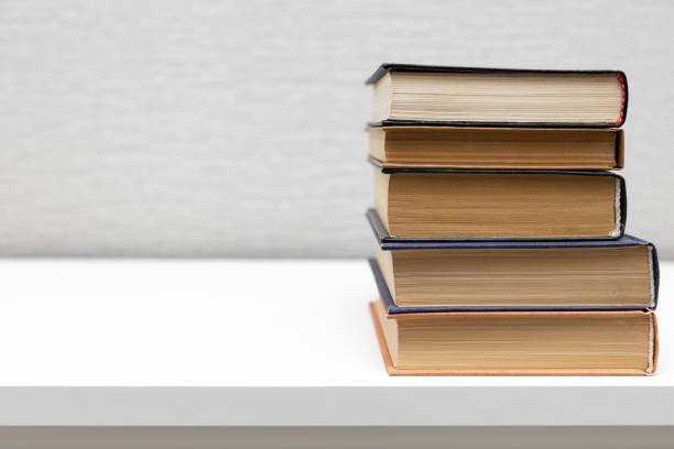 istock a stack of old books lies on the table. 1449290252