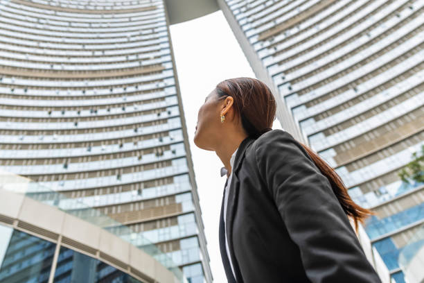 istock Young businesswoman day dreaming. 1449292217