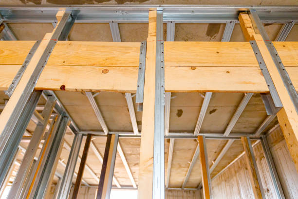 istock Frame for plasterboard wall, mounted vertical metal and wooden profiles, work in progress of unfinished edifice 1449292955