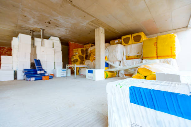 istock Stack of thermal insulation material wrapped with cellophane foil placed in storage 1449294418