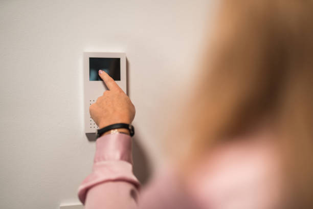 istock Caucasian Female Adjusting Temperature In The Office 1449302727