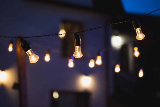 istock Light bulb decor in outdoor party 1449304955