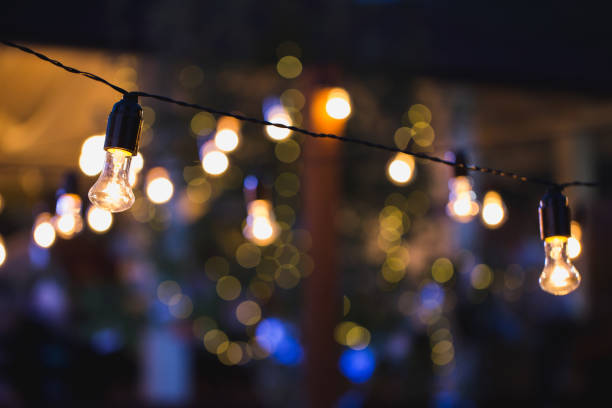 istock Light bulb decor in outdoor party 1449305019