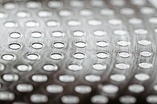 Shiny stainless steel surface. Shallow depth of field