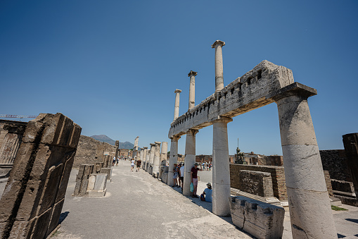 Pompei, Italy - July 20, 2022: Crowd of tourists visit the ancient Roman city Pompeii.