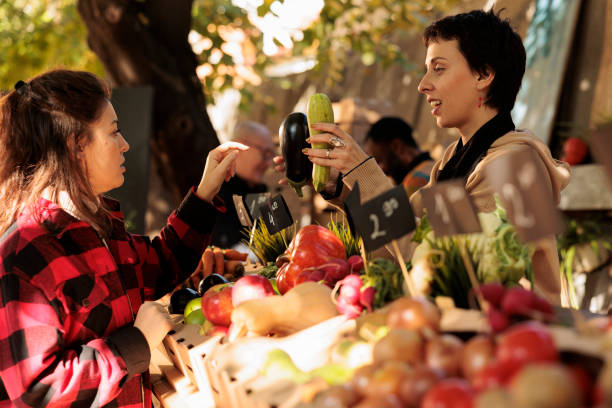 istock Woman small business owner talking to old customer 1449310954