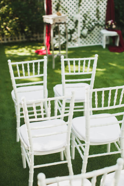 istock Beautiful white wedding chairs at the ceremony in the Park. 1449312815