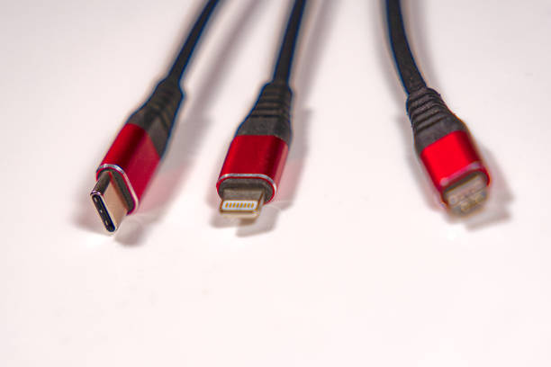 istock Red and black triple charging cable for USB-C, USB micro and Lightning mobile devices. 1449312918
