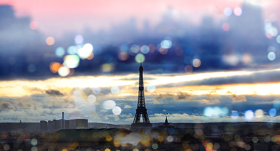 The Eiffel Tower, iconic Paris landmark with bokeh background in the night as city skyline