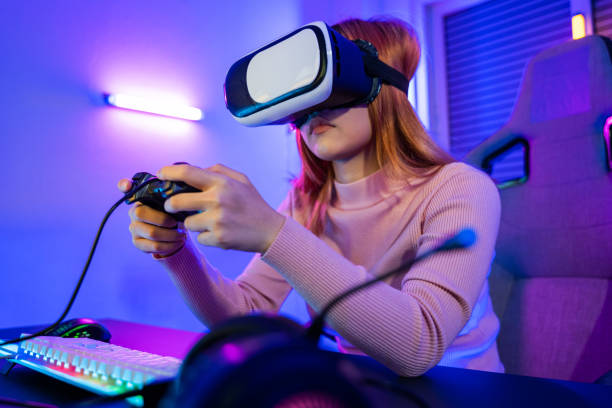 istock Gamer in VR headset glasses exploring metaverse play video game online with joystick 1449317168