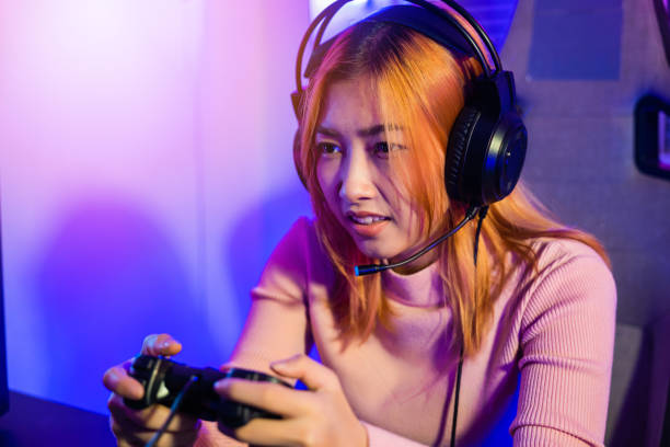istock Gamer using joystick controller for virtual tournament plays online video game with computer 1449317170