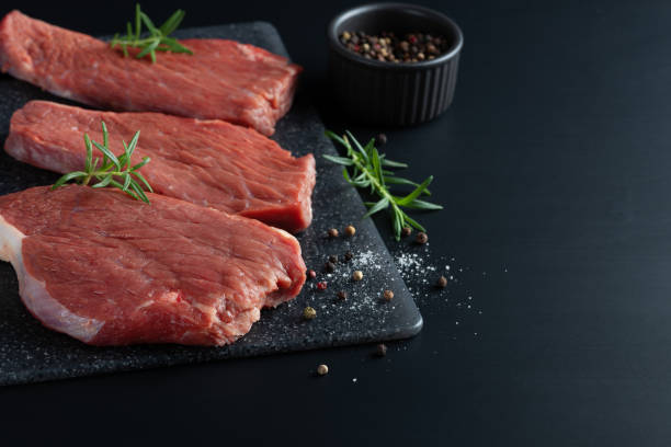 istock Fresh raw beef steak sirloin with rosemary 1449317784