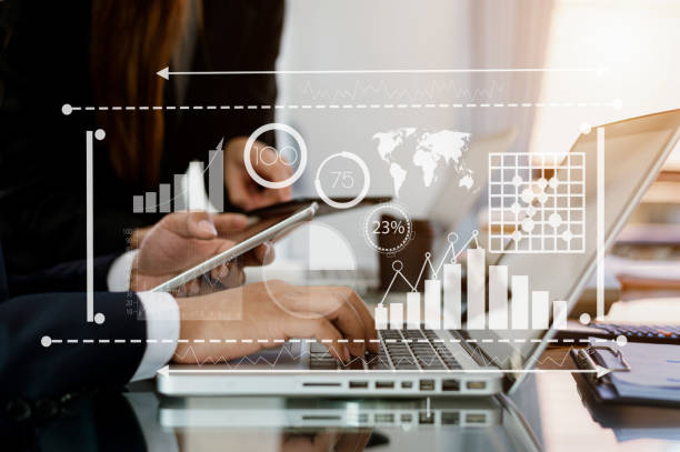 istock Two business colleague web designer discussing data and digital tablet at office. Intelligence and business analytics with key performance 1449318596