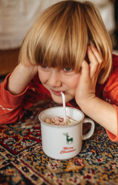 istock Portrait of a child drinking cocoa with marshmallows 1449318838