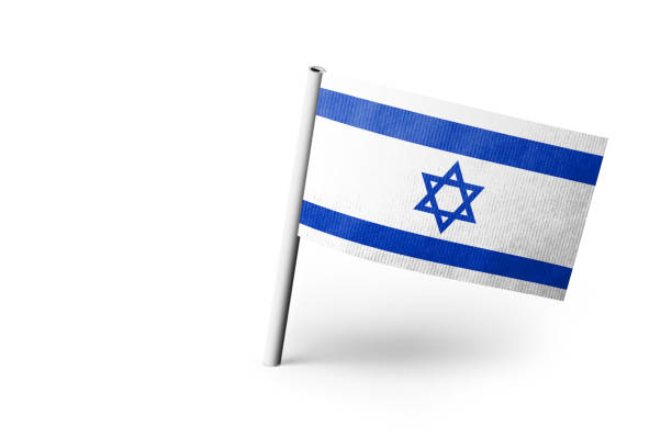 Small paper flag of Israel pinned. Isolated on white background. Horizontal orientation. Close up photography. Copy space.