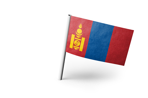 Small paper flag of Mongolia pinned. Isolated on white background. Horizontal orientation. Close up photography. Copy space.