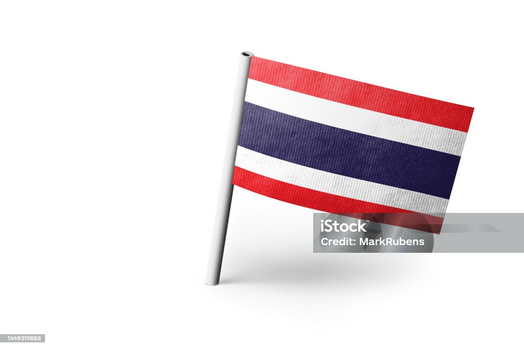 Thai flag pinned. White background. Small paper flag of Thailand pinned. Isolated on white background. Horizontal orientation. Close up photography. Copy space. Asia Stock Photo