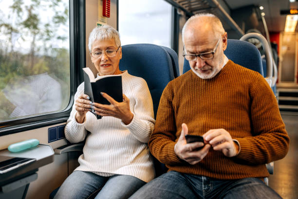 istock Senior couple travelling by train together 1449320767