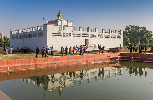 Mayadevi temple with reflection in the water in Lumbini, Nepal