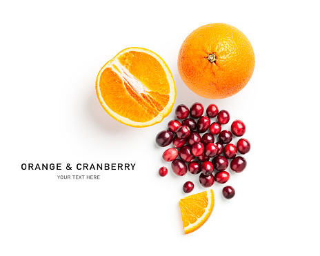 Cranberry and orange. Creative composition and layout with fresh citrus fruits and berries isolated on white background. Healthy eating and food concept. Top view, flat lay. Design element