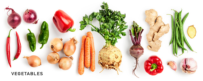 Different vegetables set. Celery, pepper, beetroot, carrot, onion, garlic, ginger and green bean isolated on white background. Healthy eating concept. Creative layout. Flat lay, top view