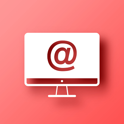 istock Desktop computer with At symbol. Icon on Red background with shadow 1449325049