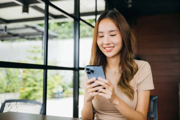 istock female hands holding and typing to communicate with others through on mobile phone 1449325502