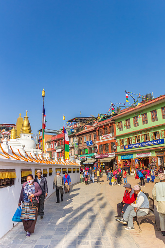 People walking round the Boudhanath stupa in Kathmandu, Nepal