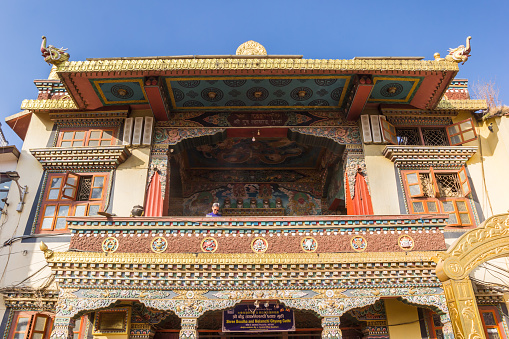Balcony of a richly decorated building at the Boudhanath stupa in Kathmandu, Nepal