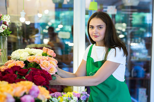 Woman holding bunch of fresh spring tulips.