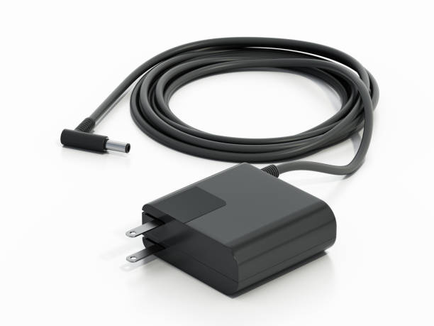 Modern black laptop battery charger isolated on white.