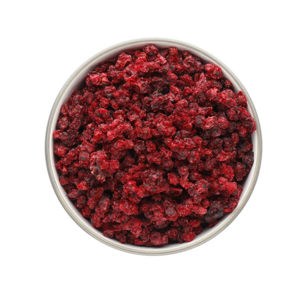 istock Dried red currants in bowl isolated on white, top view 1449328101