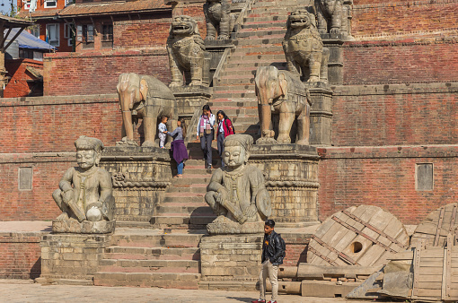 Stairs and sculptures at the Nyatapola temple on Durbar Square of Bhaktapur, Nepal