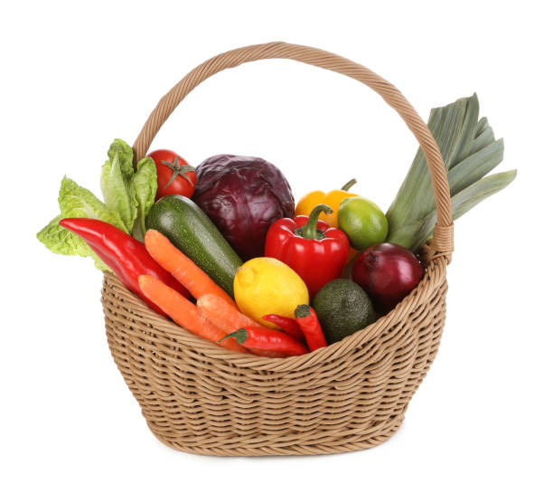 istock Fresh ripe vegetables and fruits in wicker basket on white background 1449328710